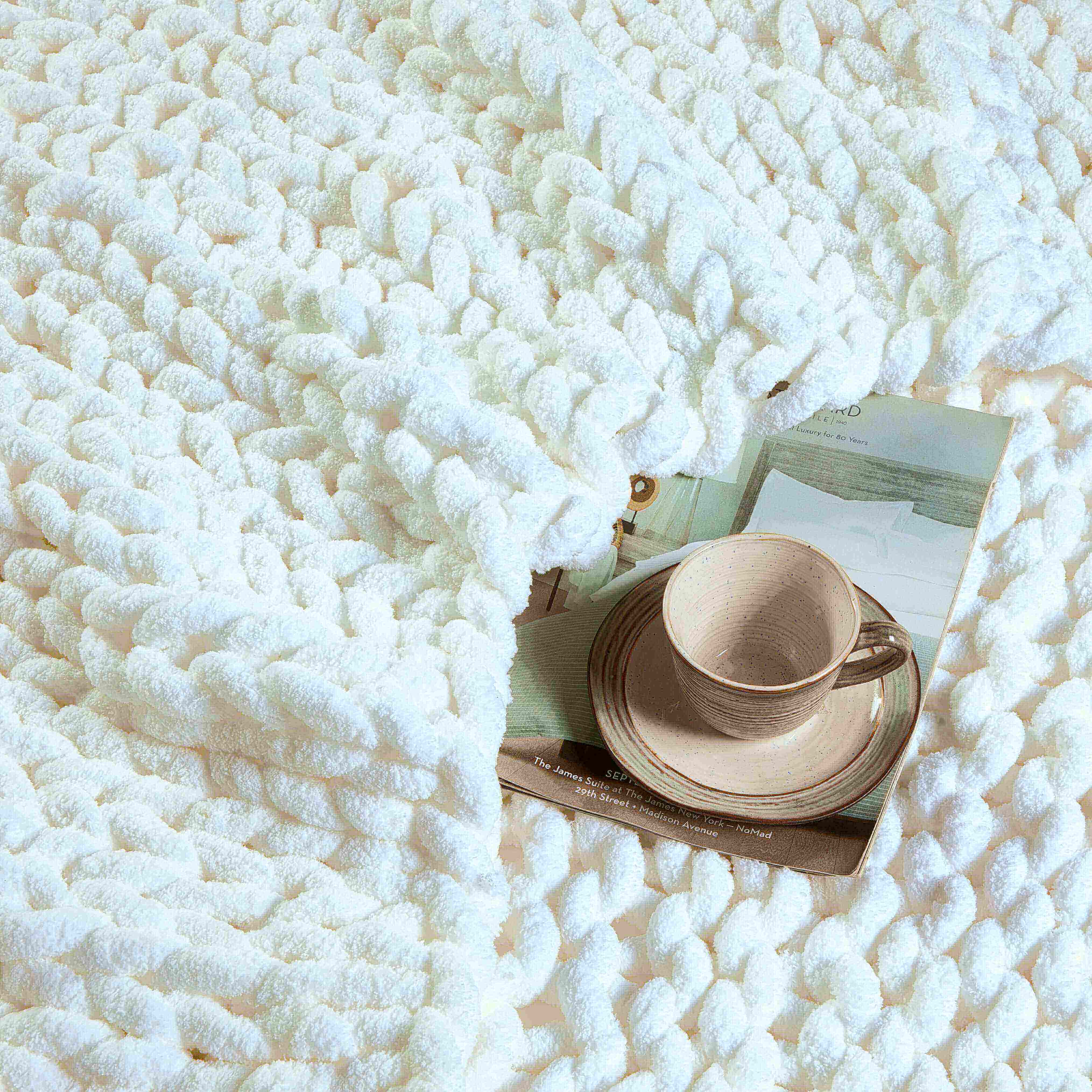 Close View of Kathy Ireland Chunky Knit Chenille Throw Blanket in cream color Close View of Kathy Ireland Chunky Knit Chenille Throw Blanket in cream color